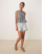 shirred top with peplum and front bows in navy white stripe