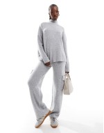 knit high neck jumper and trouser co-ord in light grey